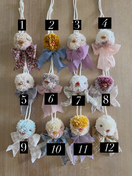 Decorative ornaments with flowers and ribbons on a wooden surface