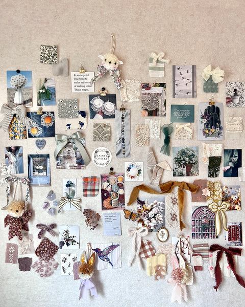 Collection of decorative items pinned to a wall, including fabric swatches and small objects.