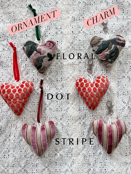 Heart-shaped ornaments with different patterns on a textured surface